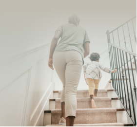 A woman and a child taking the stairs