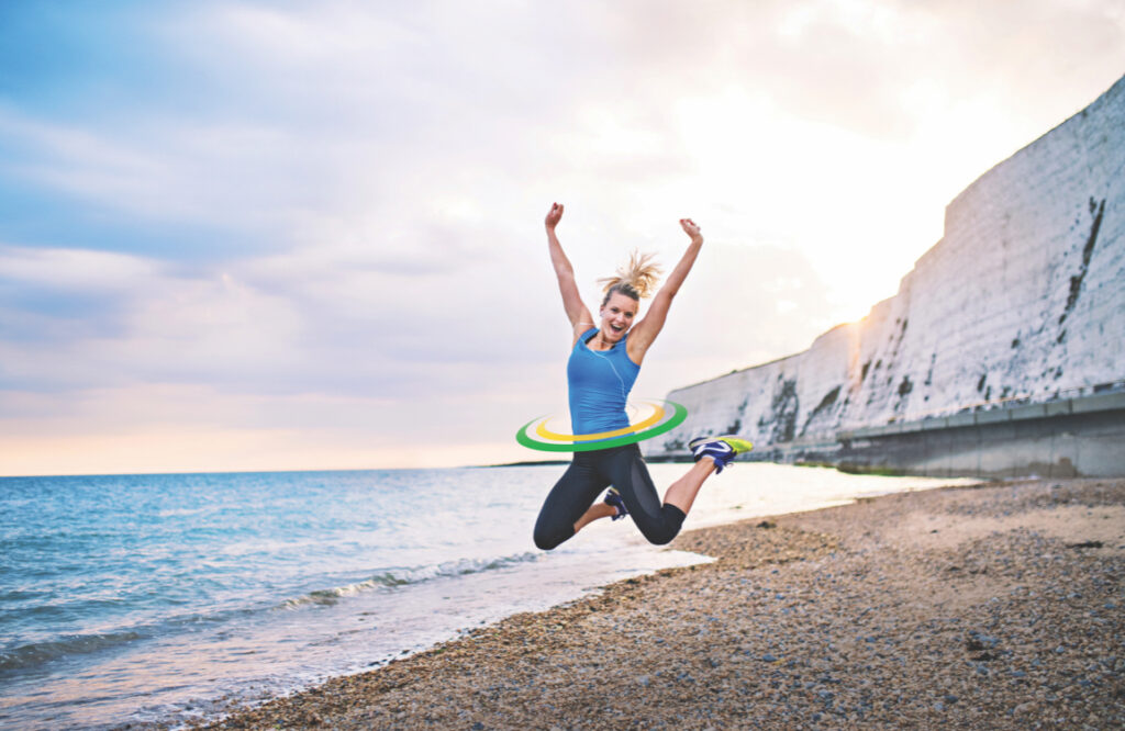 A woman jumping on a beach